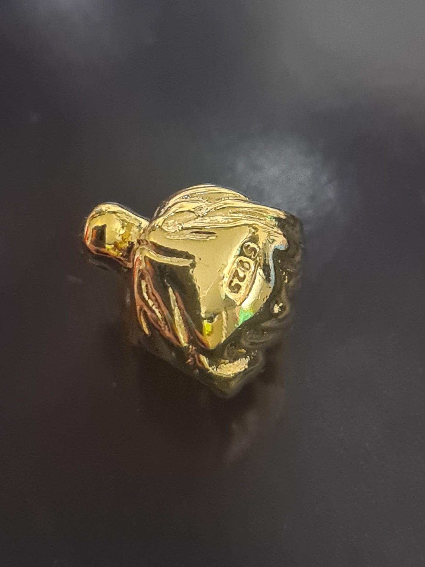 Gold mufasa charm