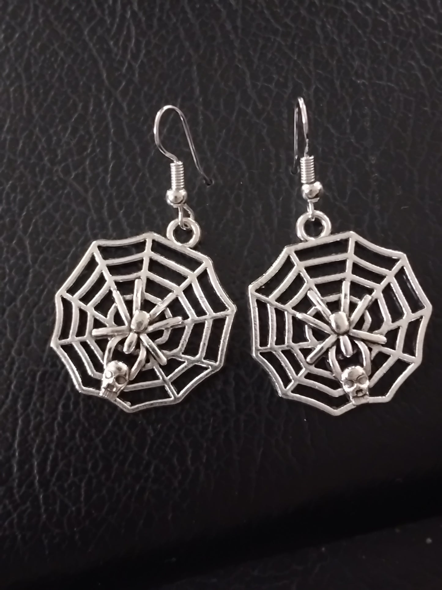 Silver spider web earrings