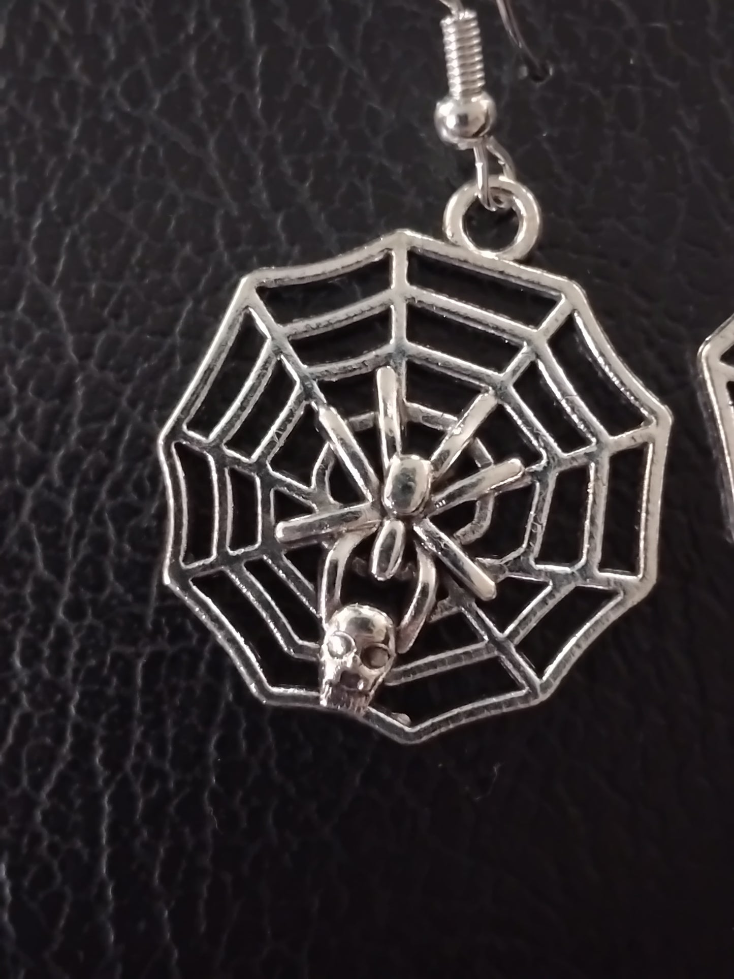 Silver spider web earrings