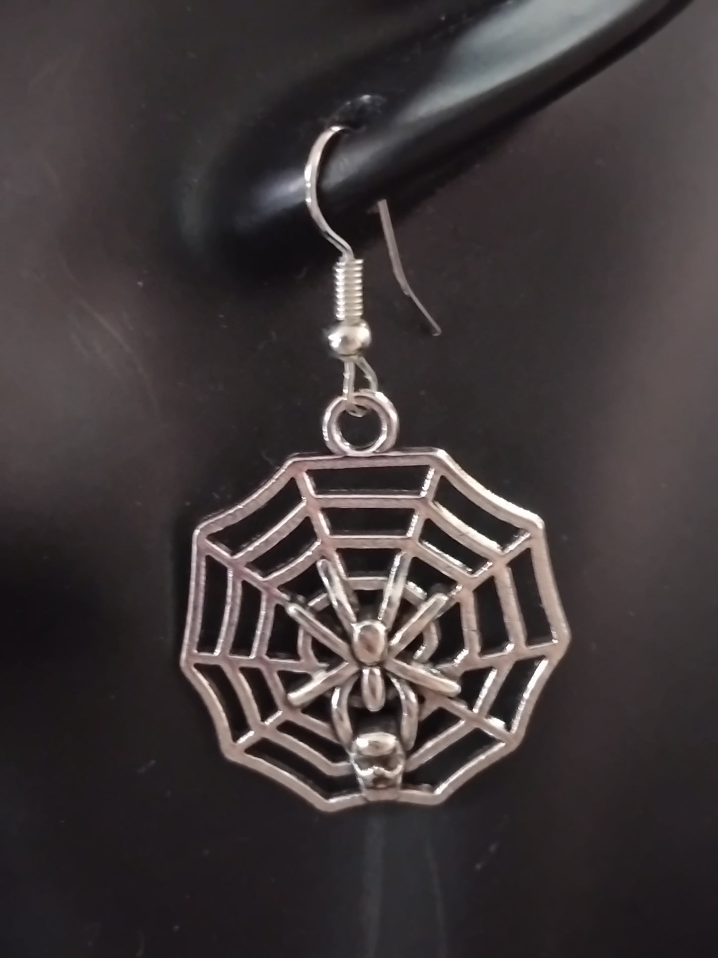 Silver spider web earrings