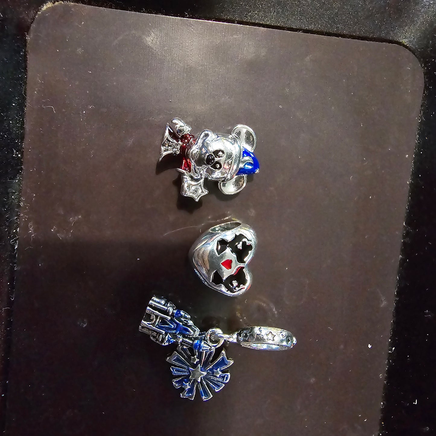 Disney charm bracelet and 3 charms