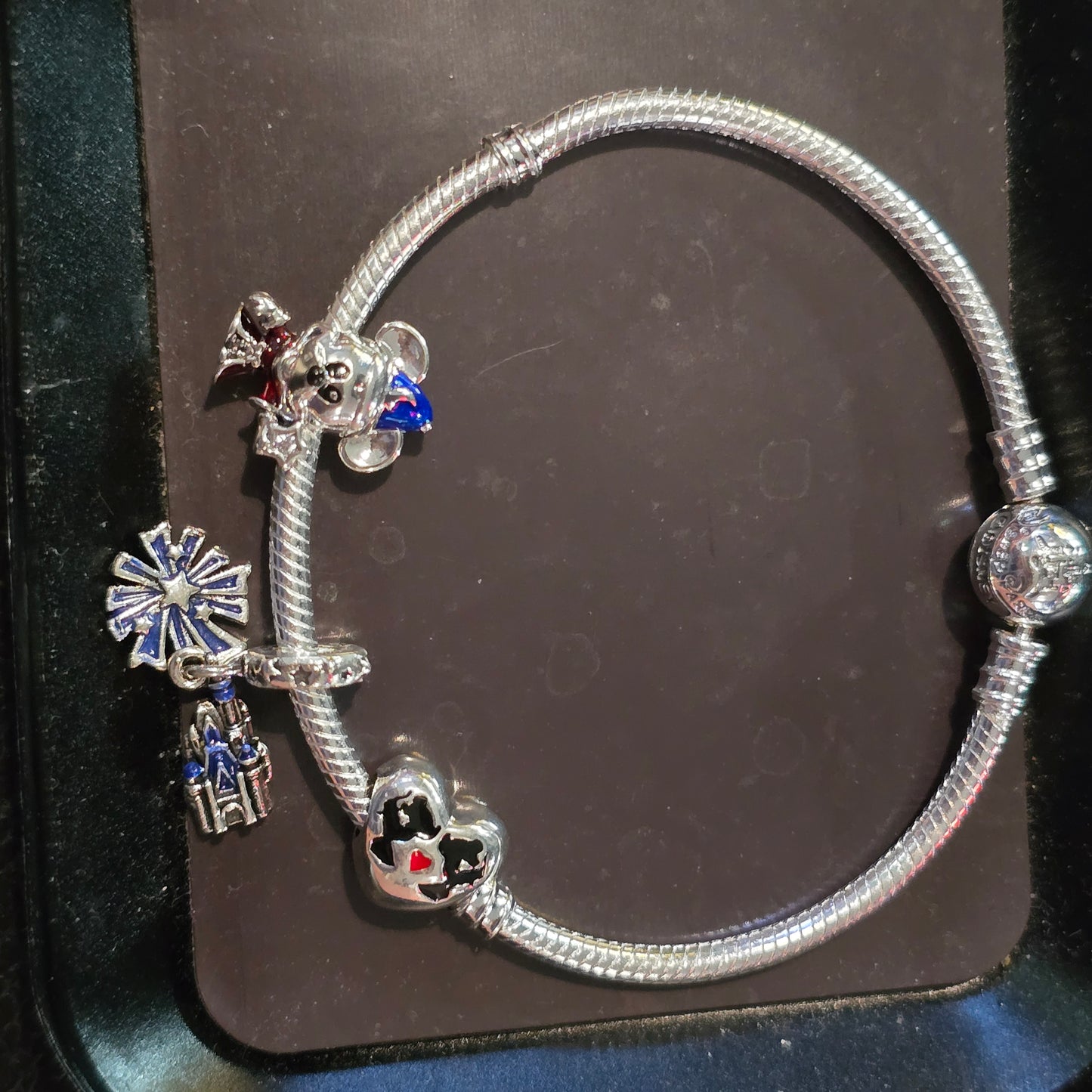 Disney charm bracelet and 3 charms