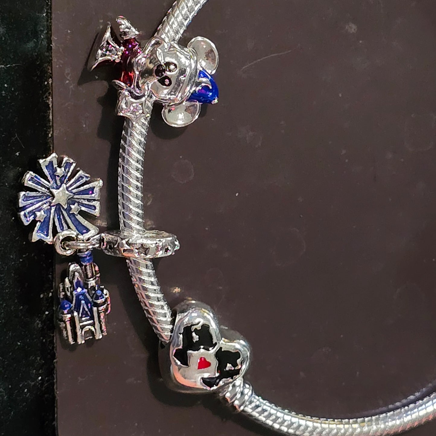 Disney charm bracelet and 3 charms