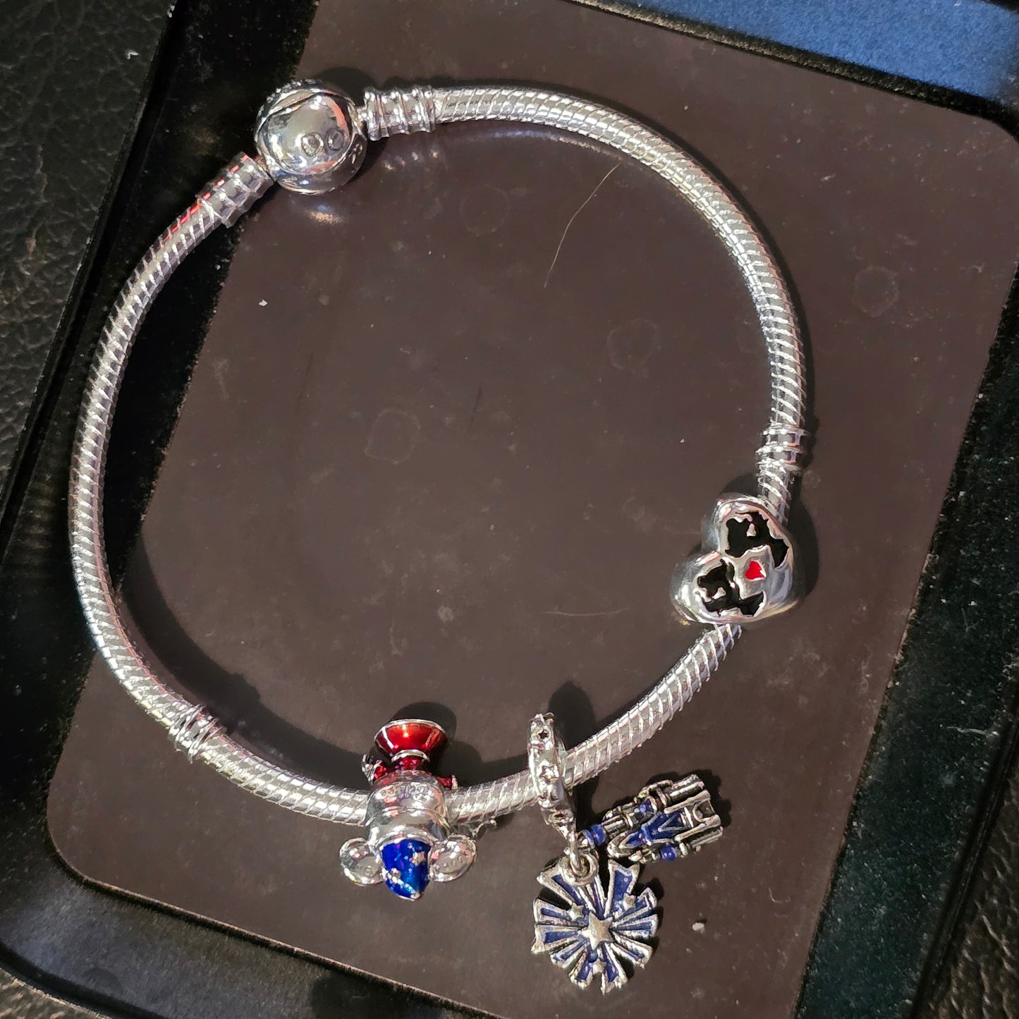 Disney charm bracelet and 3 charms