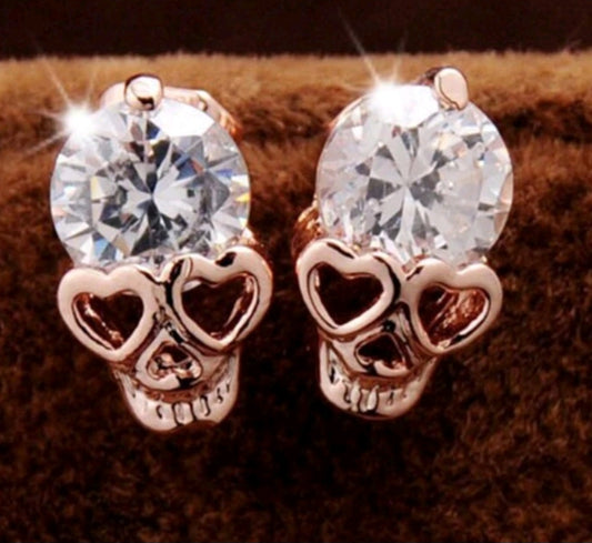 Rose gold skull gem studs