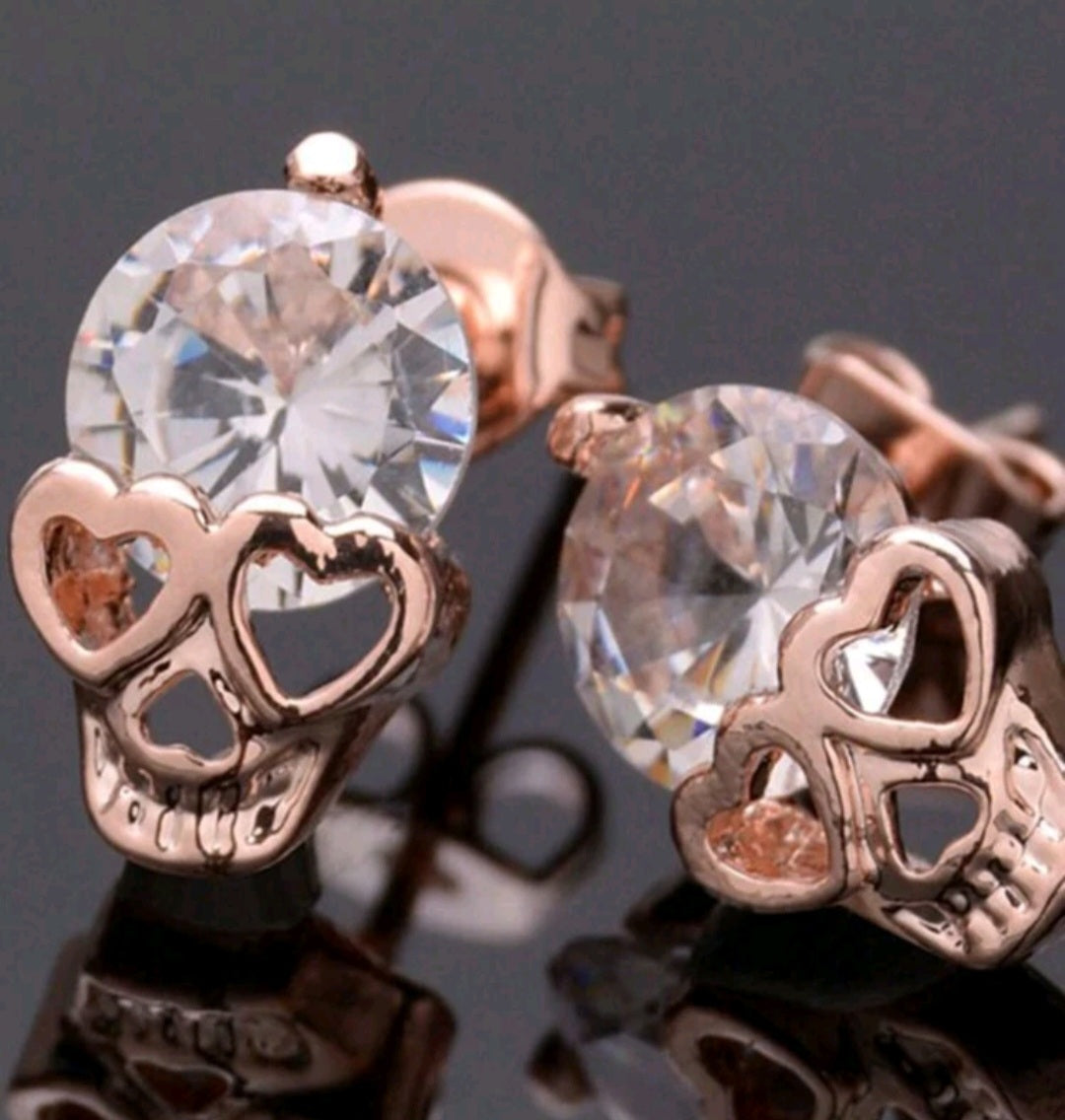 Rose gold skull gem studs